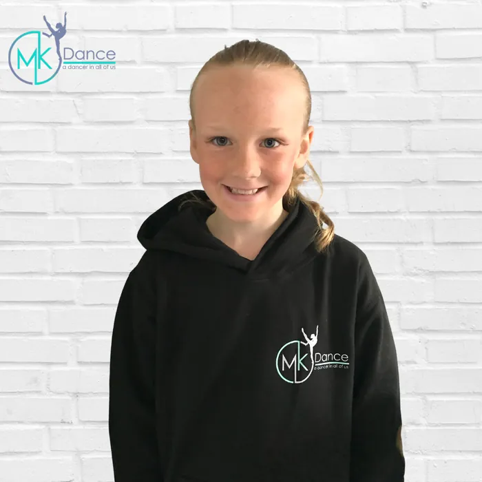 A child wearing an MK Dance hoodie